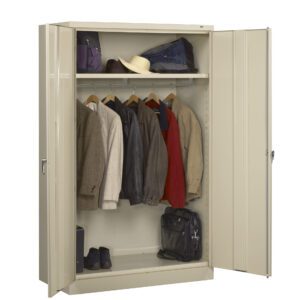 A beige metal wardrobe with open doors reveals a neatly arranged interior. Inside, jackets and coats hang on a rod, with shoes below and hats on a shelf above. A briefcase rests on the bottom shelf.
