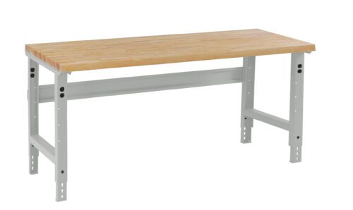 utkzqixgi4ixg51ea0tx.jpg A wooden workbench with a light brown tabletop and gray metal legs, shown against a white background. The table has adjustable leg holes for height customization.