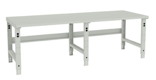 utqqcqch5tgd8pmsuw91.jpg A long, rectangular, industrial-style workbench with a grey metal frame and a smooth grey surface. The bench has sturdy metal legs and a simple design, suitable for various workspaces or workshops.