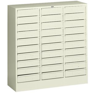 A beige metal cabinet with five rows and six columns of small drawers, each featuring a pull handle. The drawers are uniform in size, suggesting storage for tools or small parts. The cabinet has a simple and functional design.