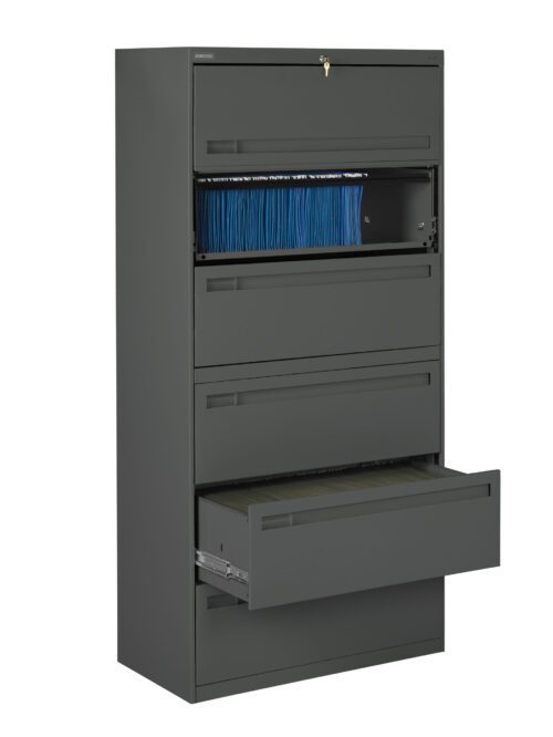 A tall, gray filing cabinet with five drawers. The second drawer from the top is partially open, revealing neatly organized blue folders. The bottom drawer is also open. A key is in the lock at the top of the cabinet.