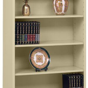 A tall beige bookshelf containing a potted plant, an ornate vase, a decorative pineapple, and multiple volumes of books with gold lettering. A decorative plate with a floral pattern is displayed on one of the shelves.