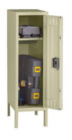 A beige metal storage locker stands open, revealing two shelves. The top shelf holds a small black suitcase, while the bottom shelf contains a drill inside a black and yellow toolbox and a small can.