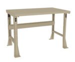 A beige industrial workbench with a flat, rectangular surface and sturdy metal legs. It has a support bar underneath and features two power outlets on the front legs. The design is simple and functional.