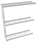 A freestanding metal shelving unit with three wire shelves. The unit is gray and features an open, minimalistic design. The shelves are evenly spaced, supported by vertical slotted metal frames on the left side.