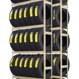 A tall, multi-tiered metal rack holds numerous black tires. Each tire has a yellow label affixed to its tread. The rack is organized neatly in vertical columns and horizontal rows, displaying the tires in a warehouse or storage setting.
