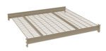 A beige metal wire shelf with a grid pattern, supported by horizontal bars on the sides and back. The shelf has a sturdy, industrial design and is viewed at an angle above.