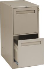 A beige metal filing cabinet with two drawers. The top drawer is closed, and the bottom drawer is open, displaying a hanging file folder inside. A small key is inserted in the lock on the top right corner of the cabinet.