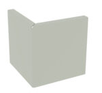 A light grey, L-shaped object with smooth surfaces, resembling a corner wall section, resting against a plain white background.