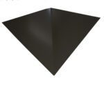 A black, geometric, triangular-shaped object with a glossy surface is centered against a white background. The shape has a prominent ridge from its top to the bottom point, creating a three-dimensional appearance.