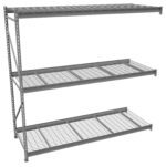 A three-tier metal shelving unit with wire grid shelves, designed for storage. The structure is sturdy with an open design, supported by metal posts. The shelves are evenly spaced and can hold various items.