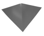 A three-dimensional, metallic, triangular shape resembling a futuristic stealth aircraft is shown against a plain background. The surface is smooth and has a dark, matte finish.