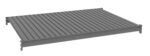 3D rendering of a gray metal platform with a grid pattern. The platform is rectangular and appears elevated with support brackets at each corner.