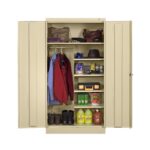 A beige storage cabinet with open doors reveals shelves containing cleaning supplies, a toolbox, boots, and various items. Clothes, including jackets and hats, hang on a rod to the left. The setup is organized and brightly lit.