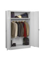 A gray metal wardrobe with open doors. Inside, several jackets, a red coat, and a hat are hanging on a rod. Shelves hold a folded blue blanket, a green bag, a black bag, and a pair of shoes at the bottom.
