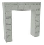 A beige, U-shaped locker system with multiple small, identical compartments. The lockers are arranged in three vertical columns with a connecting horizontal section at the top. Each locker has a lock and ventilation slits.