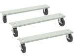 Three rectangular platforms with four black caster wheels each are aligned diagonally against a white background. The platforms are light gray and appear to be designed for mobility or transportation purposes.