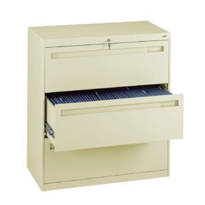 A beige, two-drawer filing cabinet with the top drawer closed and the bottom drawer open, revealing organized file folders inside. The cabinet has a lock at the top and a plain design.