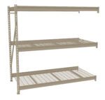 Metal storage rack with three shelves. The top and middle shelves have solid surfaces, while the bottom shelf is made of a metal grid. The rack is supported by a side frame with holes for adjustable shelving.