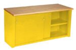 A yellow storage cabinet with a wooden top. It features two sliding doors; one is partially open, revealing shelves inside. The cabinet has metal handles and a smooth finish.
