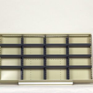 Empty beige shelving unit with multiple horizontal and vertical sections against a plain background. The shelves are adjustable, featuring dark gray brackets.