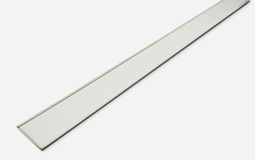 A long, thin, transparent ruler with a green tint is placed diagonally against a plain white background, next to an MH-USA Self-Adhesive Label Holder in white (H.1.97 in. x W3.94 in.), from a pack of 10.