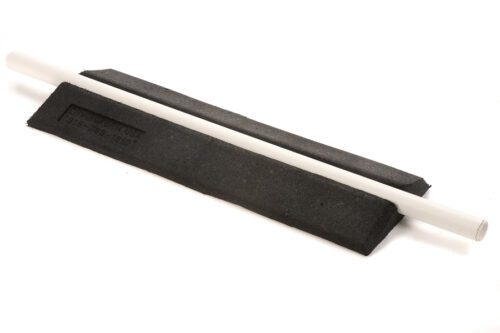 The image features two black sharpening stones with white cylindrical handles, placed parallel on a white background, resembling a TCT Crossover Hose Ramp (36x 12.5x 2.625), designed to accommodate a 2 PVC pipe. The stones textured surfaces suggest they are meant for tool sharpening or honing.