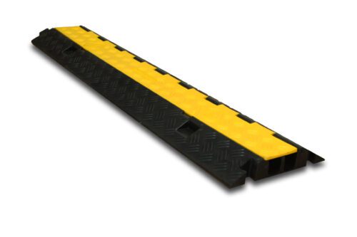 Check out the TCT 3 - Channel Light Duty Cable Protector—a durable black and yellow design with a textured surface. Its long, rectangular shape with a hinged cover is perfect for organizing cables or hoses and ensuring vehicle safety as they pass over.