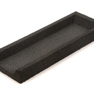 A black, rectangular foam insert with a speckled texture and deep groove is specially designed to securely hold items like the TCT Down Spout Splash Block (34x12x3). It rests on a plain white background, showcasing its robust build.