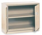A beige metal cabinet with two shelves and open hinged doors. The cabinet has metal handles and a simple, industrial design. It is empty and placed against a plain white background.