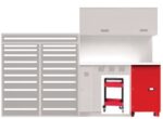 A light gray workbench setup with upper cabinets, a red rolling tool cabinet beneath, and a panel with horizontal slots on the left. A small red rolling cart is partially visible under the bench.