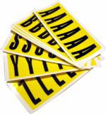 Stacked MH-USA Complete Packs of Self-Adhesive Letters in yellow, displaying large black uppercase letters As, Bs, Ss, Ys, Zs; each letter measures H.1.5 in. x W.3.54 in. on a white surface.