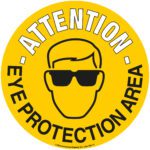 A 16.93 in. yellow circular sign with a black outline of a person wearing sunglasses, encircled by ATTENTION - EYE PROTECTION AREA. This MH-USA Floor Graphic Marker effectively highlights safety zones.