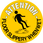 A circular MH-USA Floor Graphic Marker measures 16.93 inches in diameter and features a yellow background with a black silhouette of a person slipping, displaying the text Attention - Floor Slippery When Wet to ensure visibility and safety.