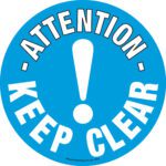 The MH-USA Floor Graphic Marker, featuring a blue circle with a central white exclamation mark, displays Attention at the top and Keep Clear boldly at the bottom. Its 16.93 in. diameter ensures maximum visibility and safety.