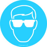 A simple white outline of a person in safety goggles on a blue circular background complements the MH-USA Floor Graphic Markers Without Text - 16.93 in. dia. - Eye Protection, highlighting the need for eye protection.