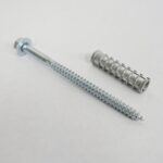 The TCT 6 Lag Bolt with a hexagonal head and ribbed masonry wall plug are showcased on a plain white background, offering durable, heavy-duty fastening with added protection from the shield.