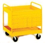 A yellow industrial cart with four wheels and a flat top surface. It has several small drawers on one side and an open shelf at the bottom.