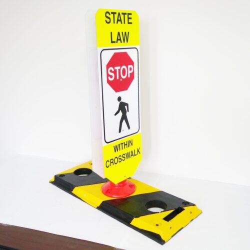 The TCT Flexible Post Crosswalk System, State Law - Stop, includes a yellow and white sign with a red stop sign icon above a figure walking labeled Within Crosswalk, and it is mounted on a black and yellow base for better visibility.