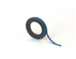 A roll of MH-USA Magnetic Easy-Wipe Strip - Blue, with part of the strip peeled back, is coiled around a cardboard core against a white background, dimensions H.0.39 in x W3.94 in.
