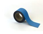 A blue MH-USA Magnetic Easy-Wipe Strip unspools slightly on a white background. Neatly rolled with a visible cardboard core, it features a matte finish, ideal for versatile applications. Size: H2.76 x W3.94.