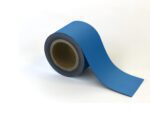 A roll resembling the MH-USA Magnetic Easy-Wipe Strip in blue is partially unrolled on a white surface, revealing the inner cardboard core with its strip extending outward seamlessly.