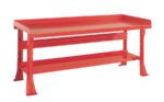 A red, sturdy metal workbench with a flat surface and raised edges. It features a lower shelf for additional storage, supported by four wide, solid legs.