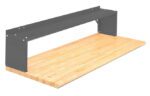 Workbench with a wooden tabletop and a gray metal shelf above. The design is simple and functional, suitable for various workshop or garage settings. The shelf is supported by two side panels.