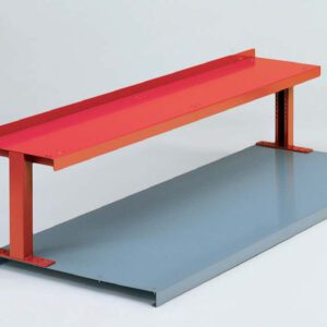A minimalist bench with a red top supported by two vertical red beams, resting on a large gray rectangular base. The design is simple, with clean lines and contrasting colors against a plain background.