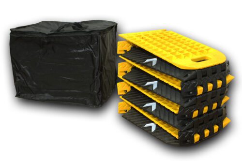 A set of four vertically stacked black and yellow traction boards with textured surfaces and carrying handles, plus a black bag, offer stability and convenience like the TCT Hinged Portable Speed Bump (8 sections, Black/Yellow, 118L x 9.75W x 1H) for versatile use.