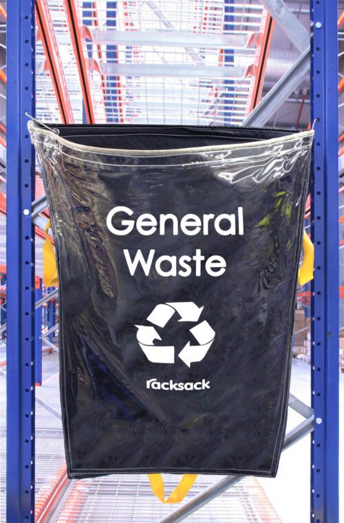 RSCL1-GW.jpg A clear MH-USA Racksack labeled General Waste with a recycling symbol hangs on a blue industrial racking system, set against metal shelves in a busy warehouse, showcasing the quality of MH-USA Racksack solutions for waste management.