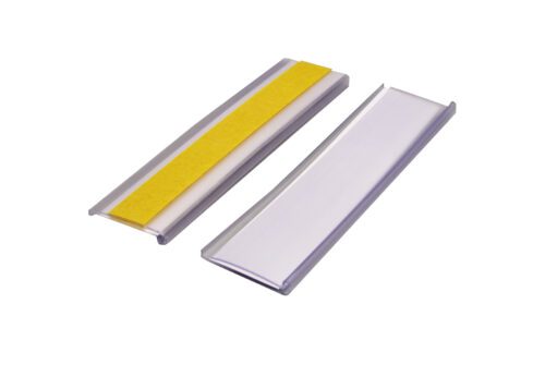 Two rectangular metallic objects are shown on a white background: a plain silver one and another with a yellow strip. Both have slightly raised edges, resembling the elegant design of an MH-USA Self-Adhesive Ticket Holder - H.0.98 in. x W.3.94 in., Pack of 100, Including Card.