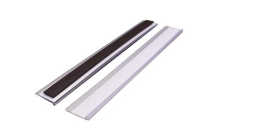 TS220M.jpg The MH-USA Magnetic Ticket Holder, measuring H.0.98 in. x W.7.87 in., is shown as two elongated rectangles on a white background—one with a dark center and the other uniformly light-colored—designed for securely holding your cards.