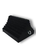 The TCT Triangle Heavy-Duty Wheel Chock - Ribbed Double Sided Black (10x8x6) has a ribbed, double-sided black surface for enhanced grip, a sturdy metal ring, and effectively prevents vehicle movement. It is featured against a plain white background.